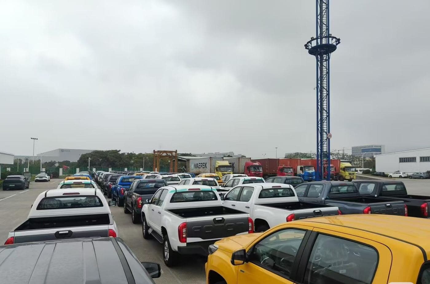 Export vehicles parked in rows at a port vehicle yard