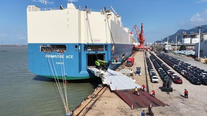 New cars queued at the quay for loading onto a Ro-Ro vessel
